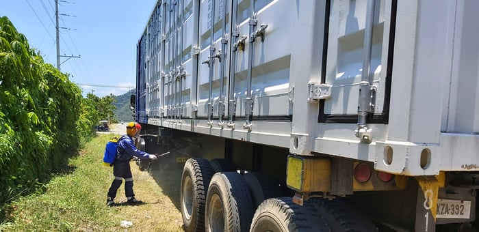 Disinfecting containers before entering energy stoarge project site in Southeast Asia